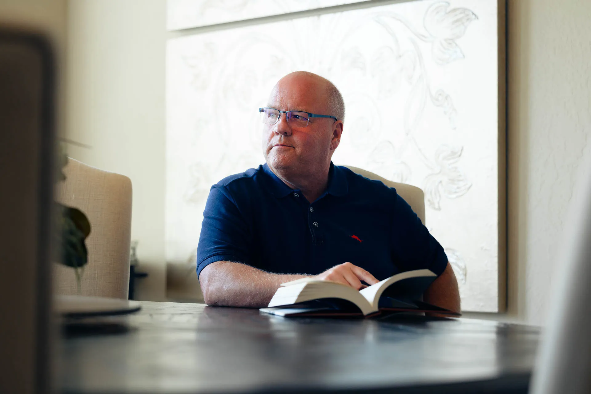 Gary Warwick reading at his desk